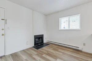 Living room with fireplace at Goss Commons, Boulder, CO apartments