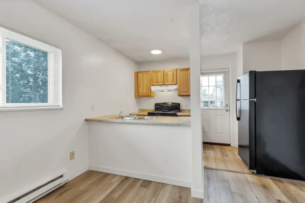 Modern kitchen and dining area at Goss Commons, apartments Boulder, Colorado