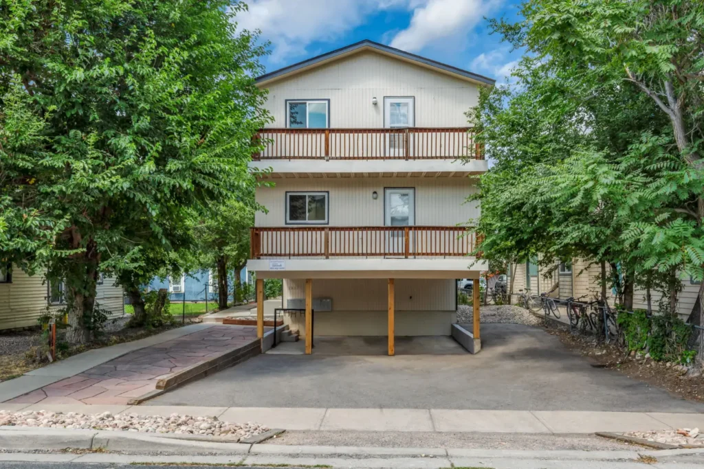 apartment exterior with covered parking at Goss Commons, Boulder apartments