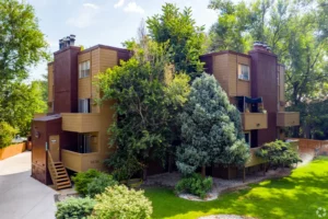 building exterior surrounded by trees at Creekside Apts, Boulder apartments for rent
