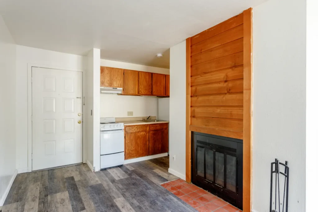 Living room with fireplace at Spruce Street, apartments near CU Boulder